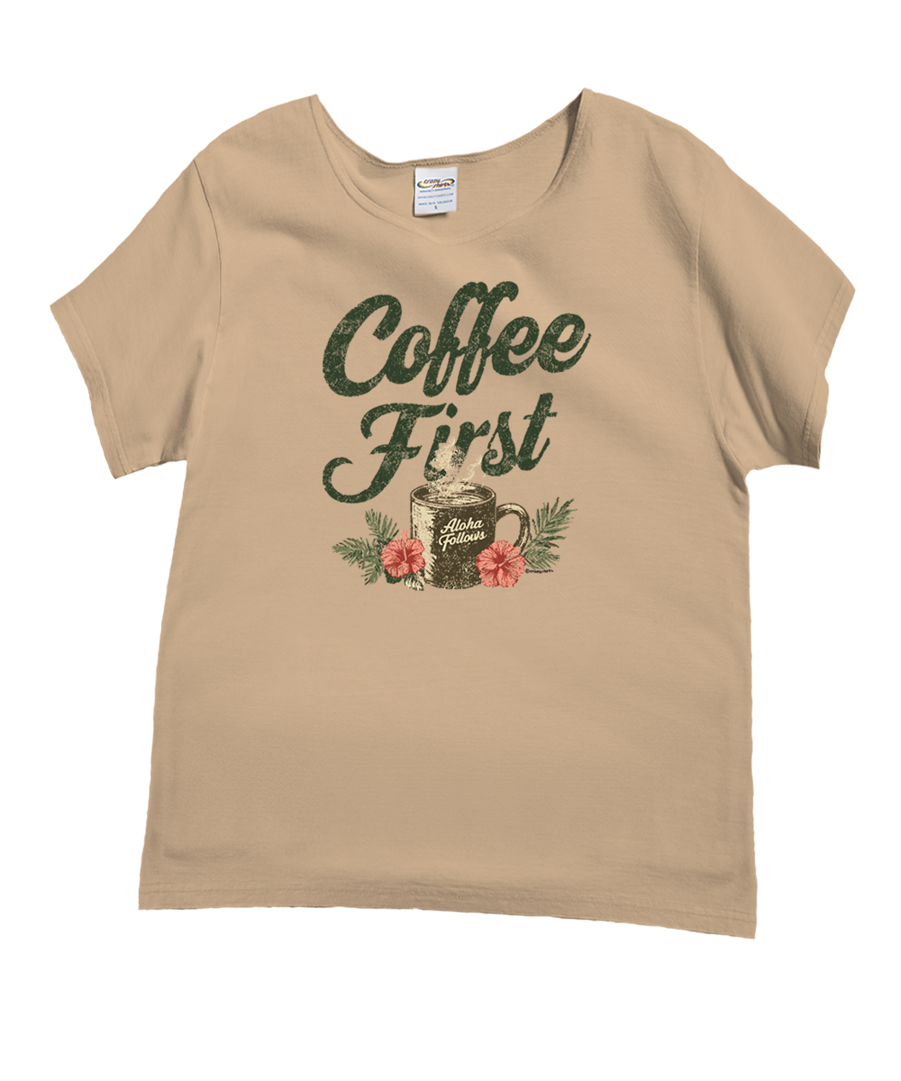 A beige short-sleeve t-shirt with a 'Coffee First' graphic print featuring a mug, flowers, and green foliage on a white background. View 1