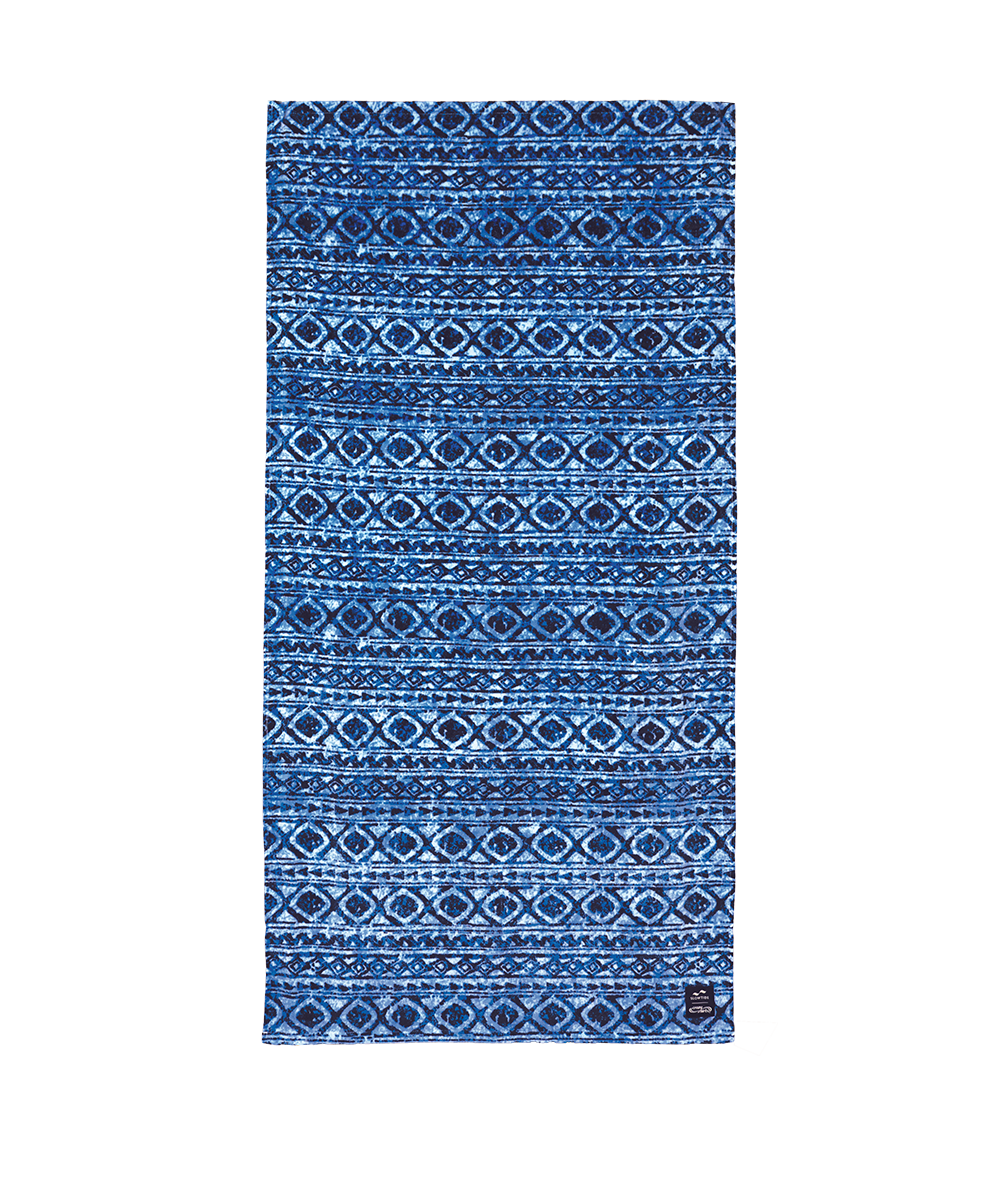 A rectangular blue patterned towel or mat featuring horizontal bands of geometric and diamond motifs in various shades of blue, navy, and white, shown flat against a white background. View 1