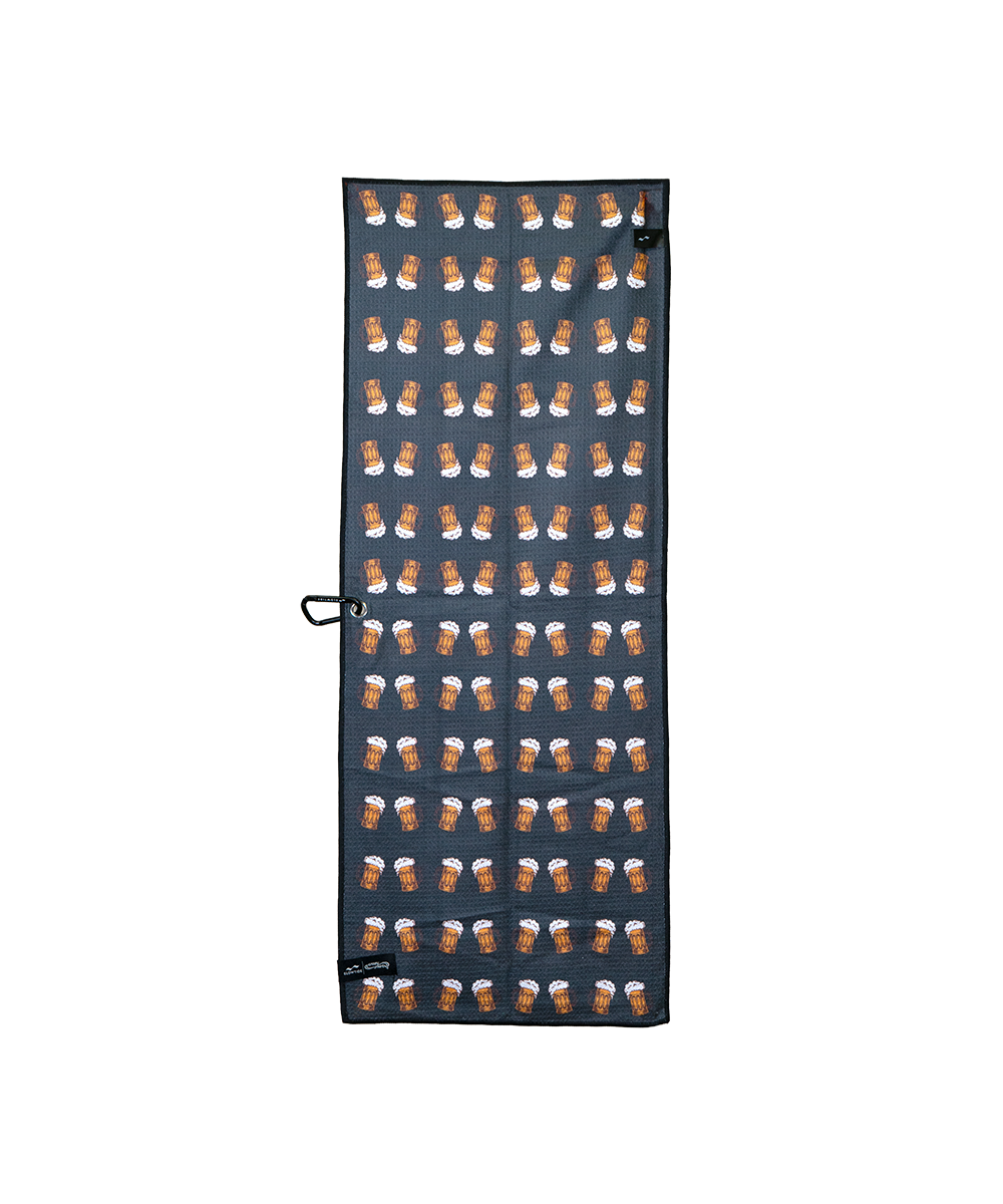A long rectangular dark gray towel or mat featuring a repeating pattern of small brown and white dog faces, shown flat against a plain white background. View 2