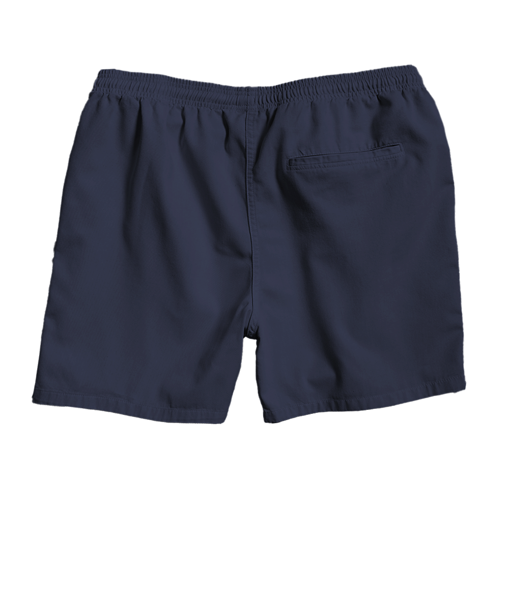 A pair of dark navy blue swim trunks with an elastic waistband and a side pocket, shown from the back on a white background. View 4