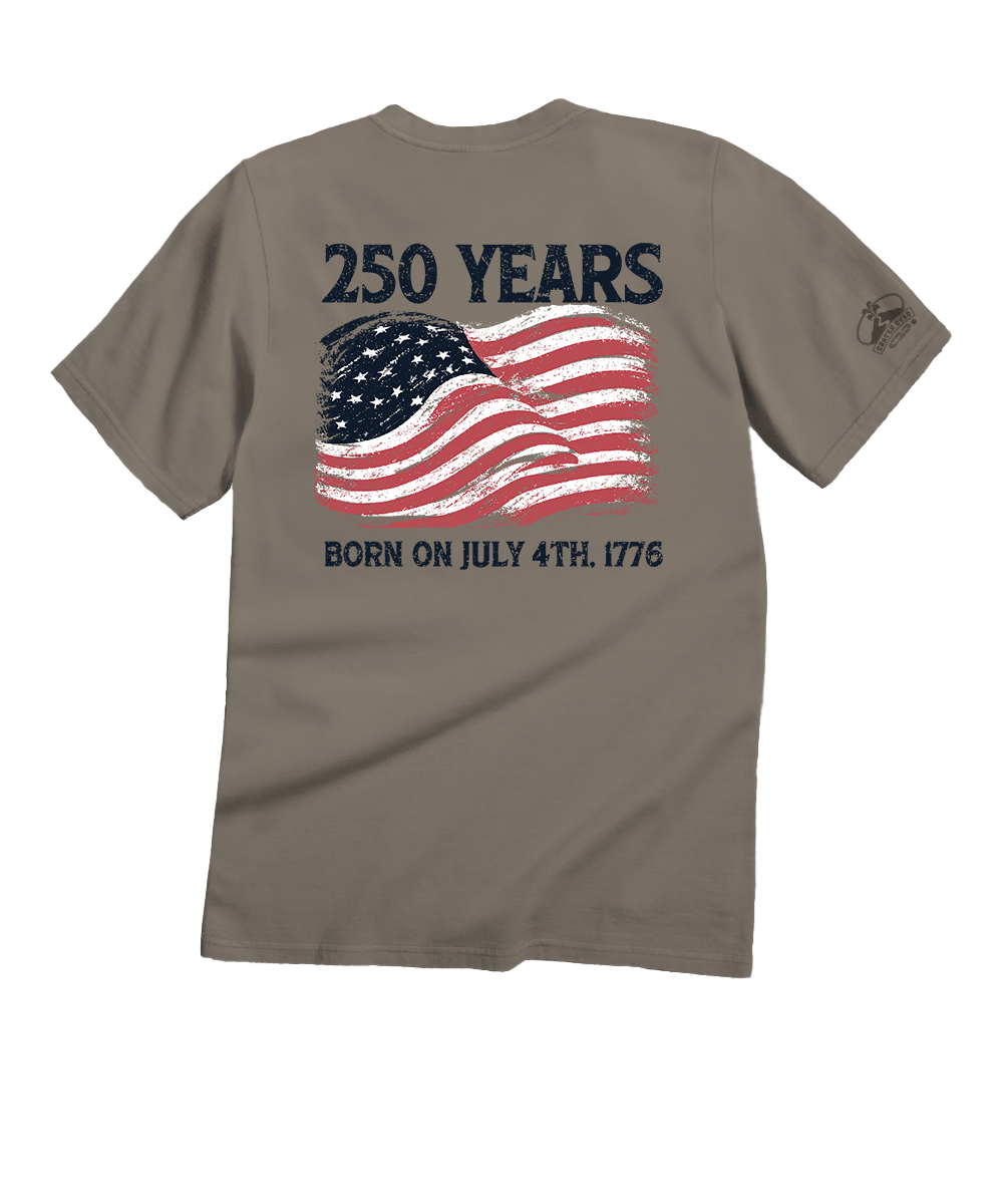 Brown t-shirt with American flag graphic and text on a white background
