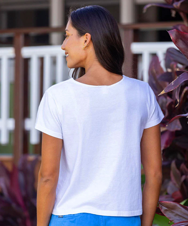 Woman wearing a white t-shirt with a blurred background View 3
