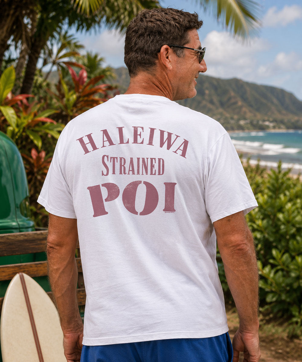 Person wearing a white t-shirt with red text on the back, standing outdoors. View 2