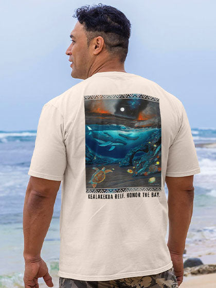 Man wearing a t-shirt with a graphic design on the beach