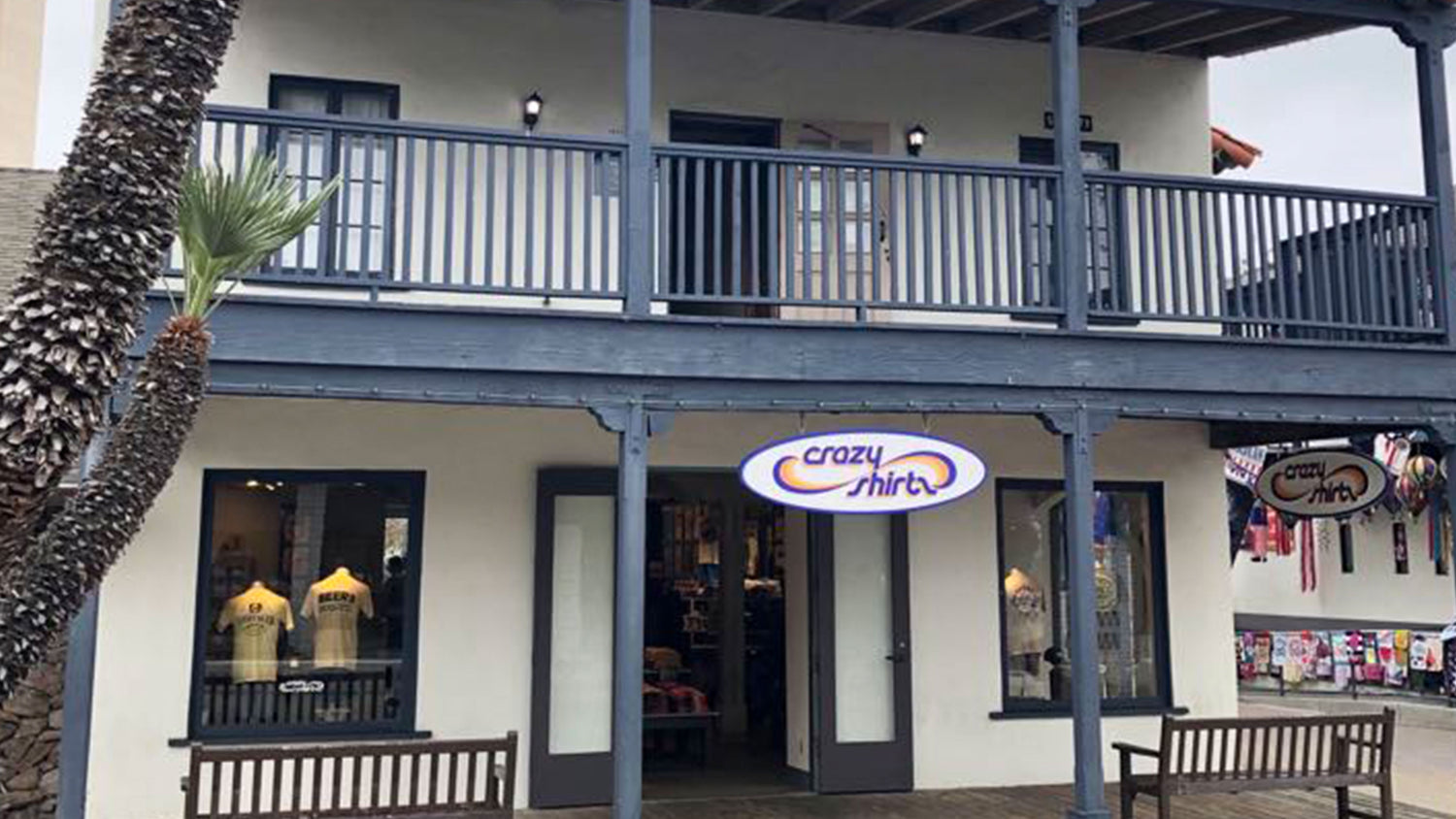 Sea Port Village storefront with 'crazy shirts' sign on a building exterior