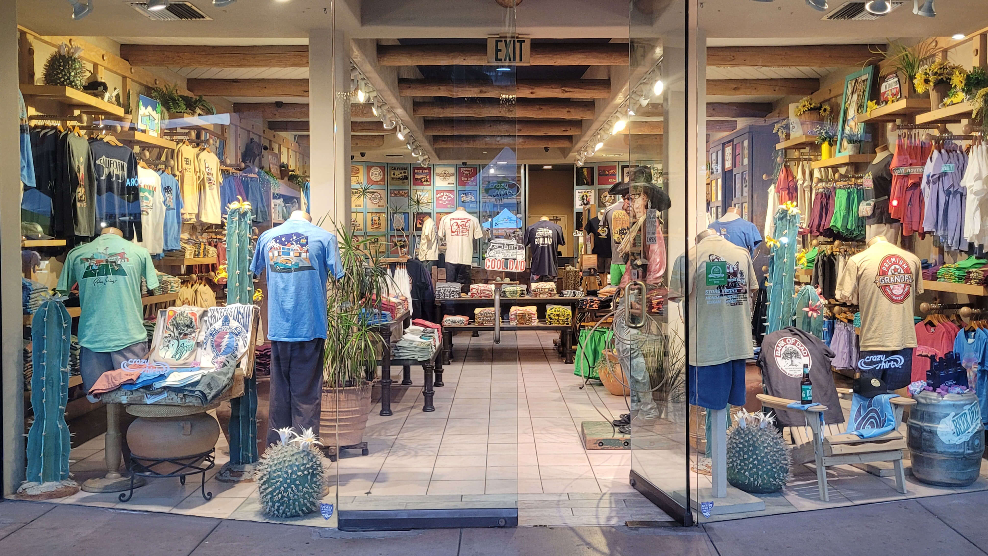 Palm Springs store interior with mannequins wearing blue shirts in a retail setting