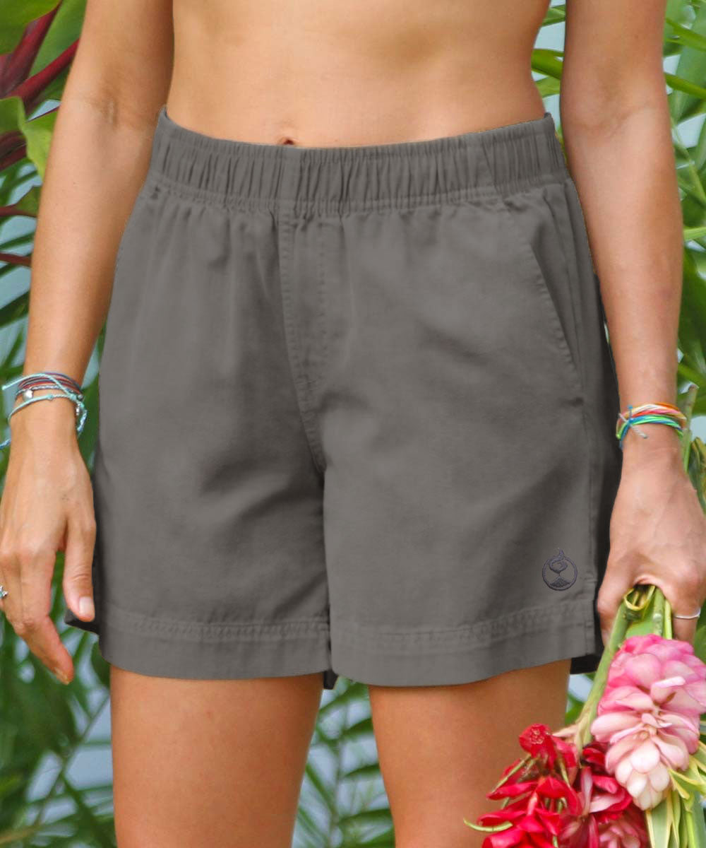 A person wearing gray twill shorts with a stretch elastic waistband, standing in front of foliage View 2