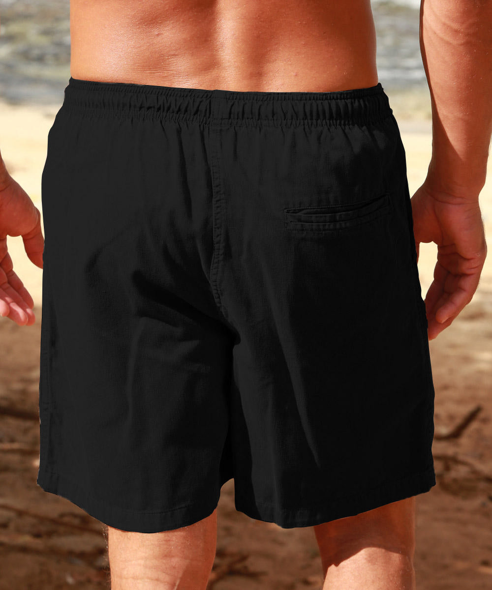 A pair of black cotton twill shorts with an elastic waistband, deep front pockets, and a triple-stitched drawstring. View 3
