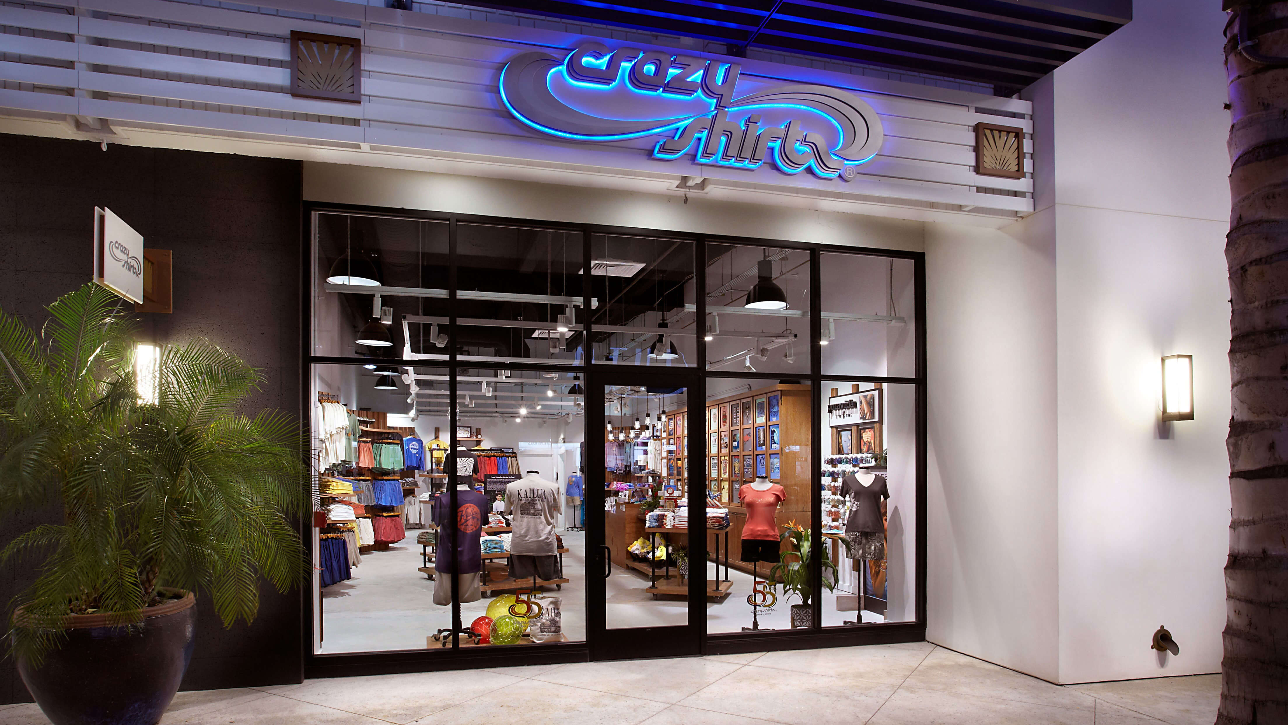 Kailua Storefront with 'Crazy Shirts' sign at night