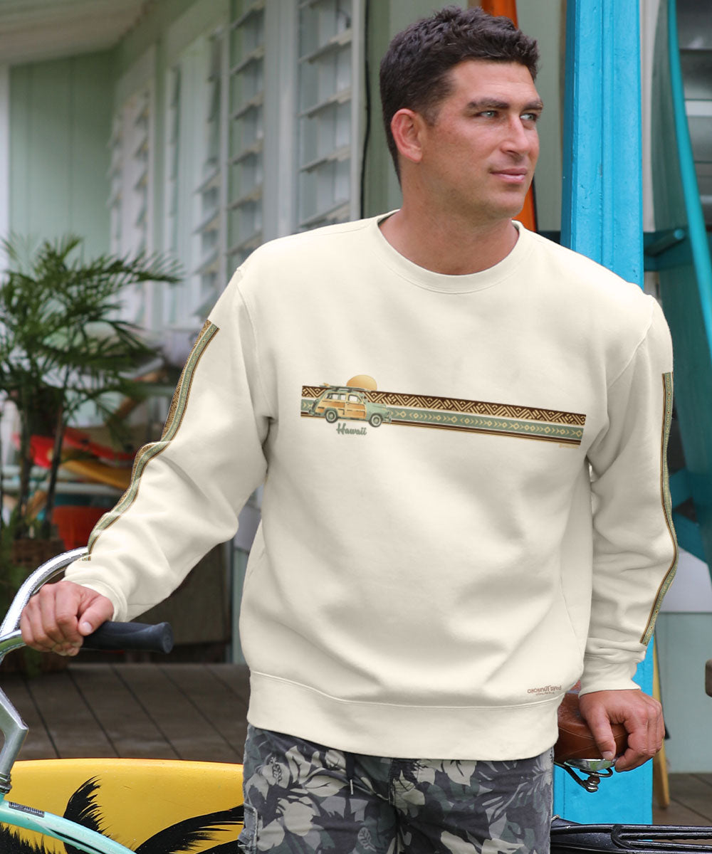 A man wearing a beige long sleeve sweatshirt with a graphic print on the front View 2
