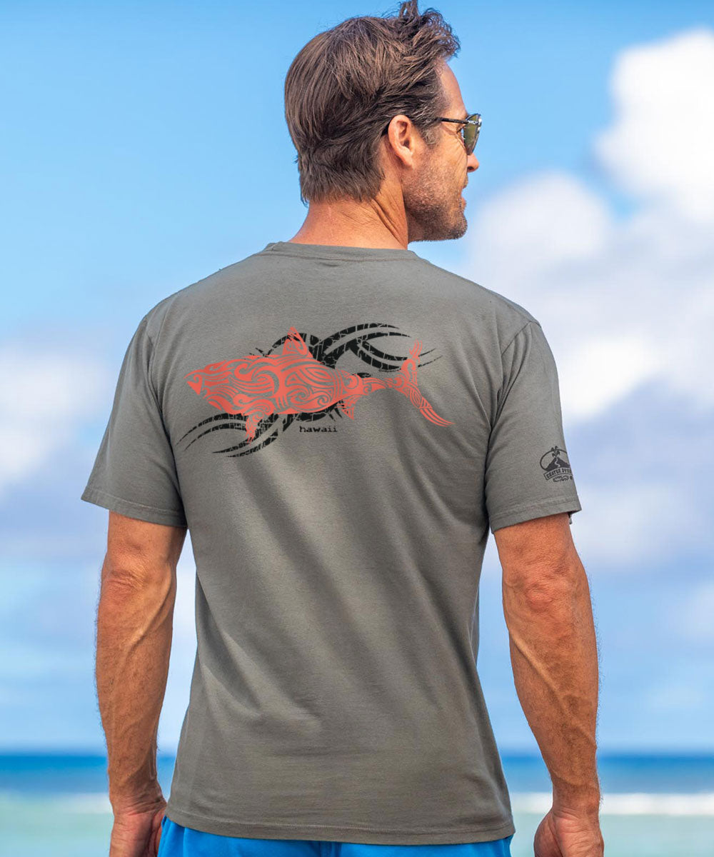 Man wearing a gray t-shirt with a red fish design on the beach View 2