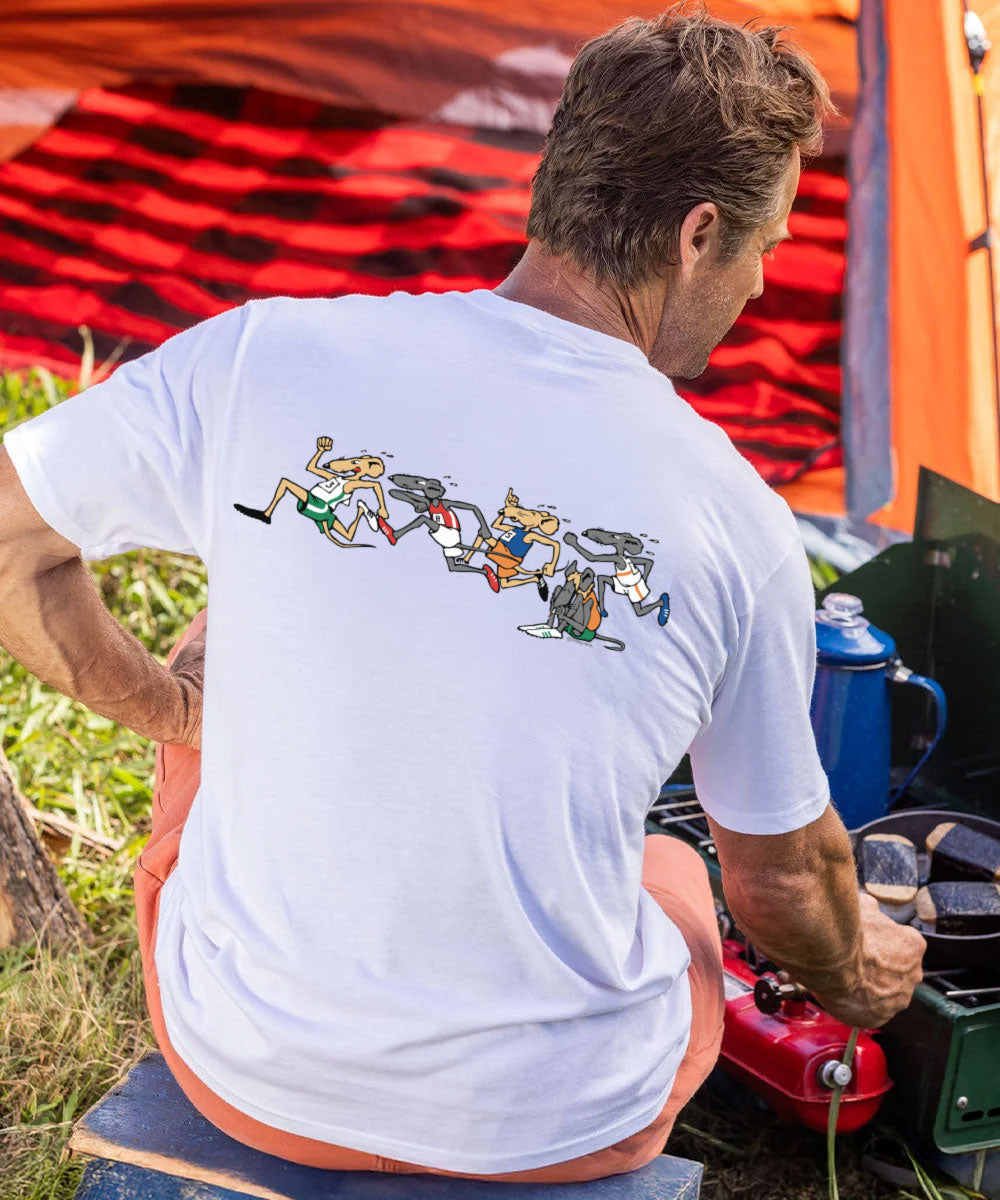 Man grilling musubis wearing a shirt with rats running on it.  View 3