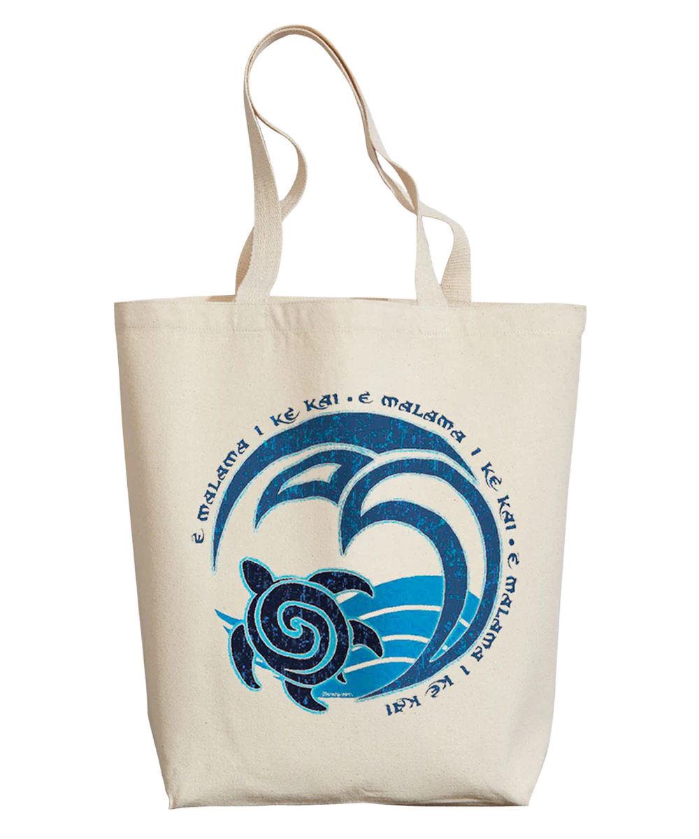 Beige tote bag with blue turtle and wave design on a white background View 1