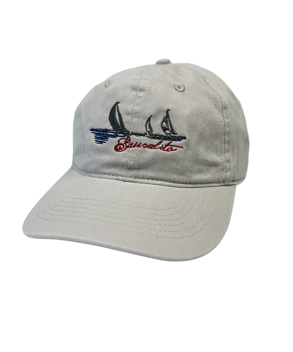 Beige cap with sailboat design and text on a white background View 1