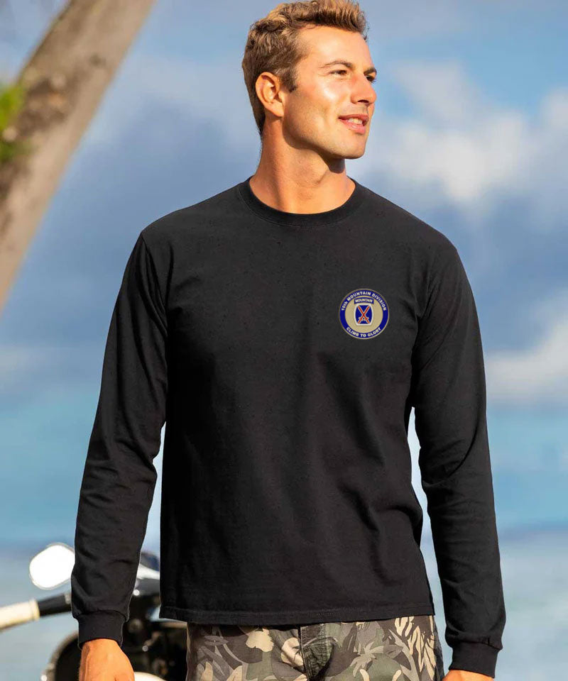 Man wearing a black long-sleeve shirt with a logo outdoors against a blue sky. View 3