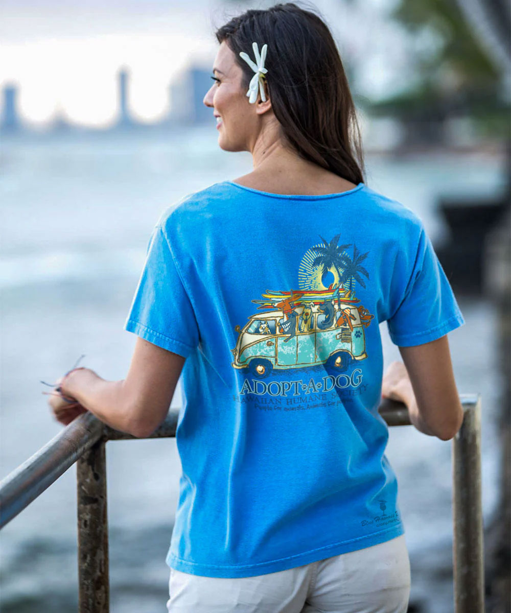 Woman wearing a blue t-shirt with a graphic design by the water View 3