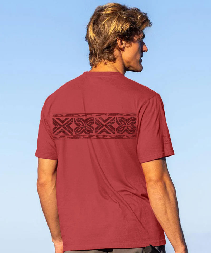 Man wearing red shirt standing on the beach View 3