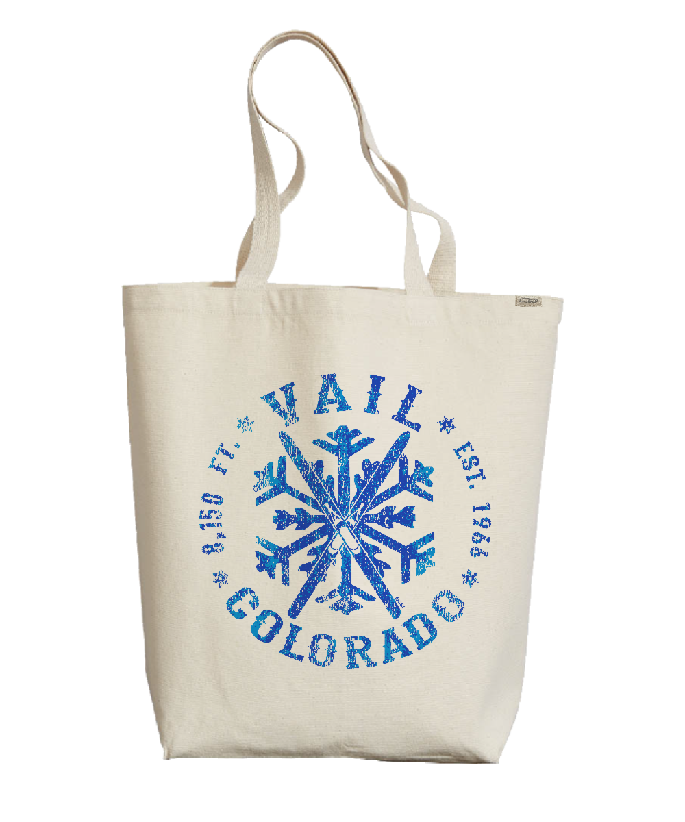 Beige tote bag with blue snowflake design and text on a white background View 1