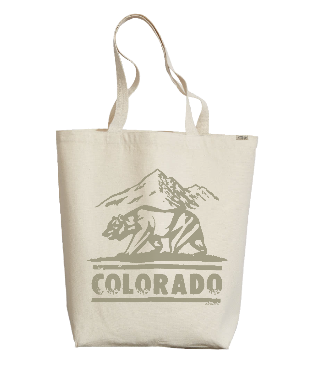 Beige tote bag with bear and mountain graphic and 'Colorado' text on a white background View 1