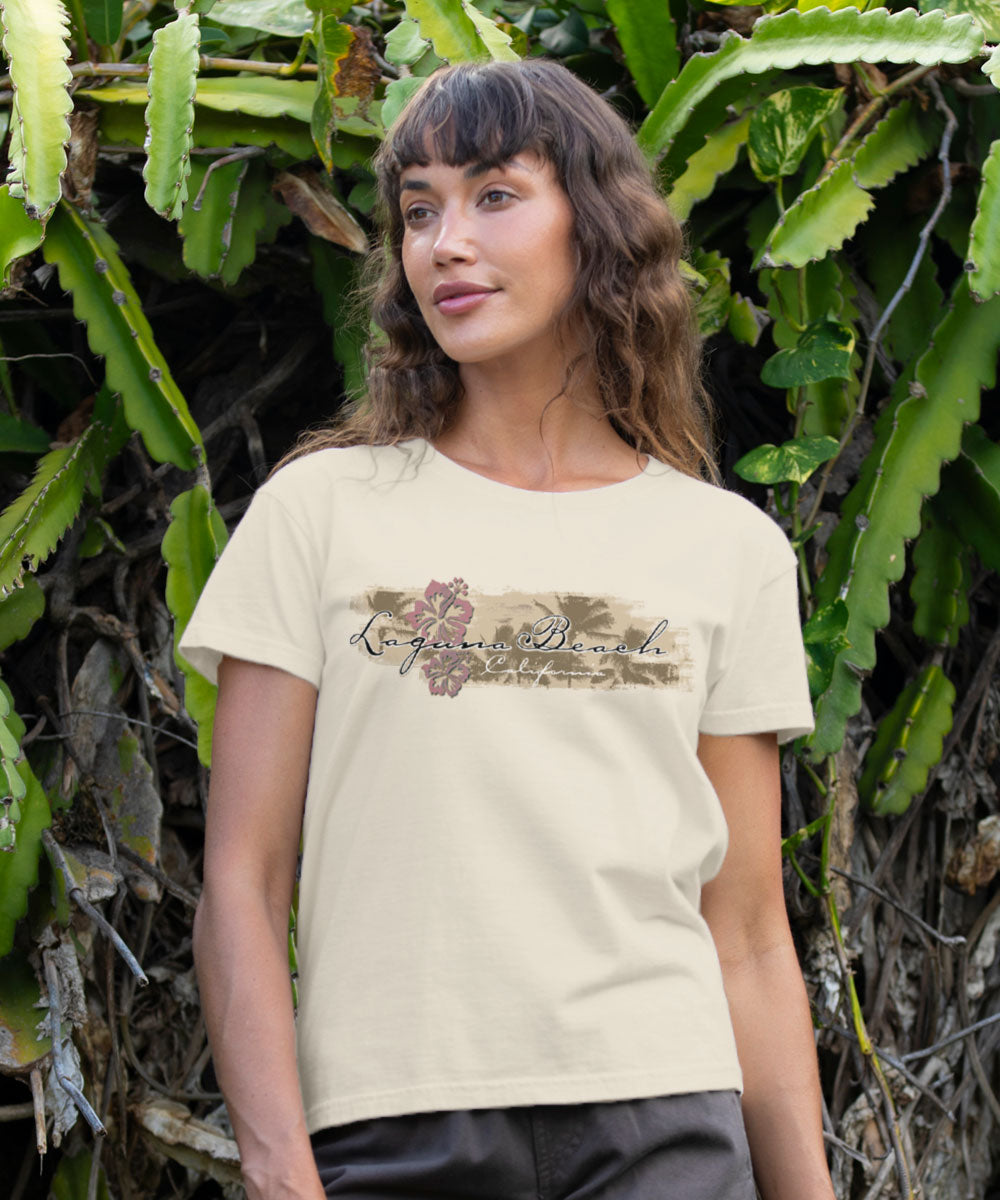 Woman wearing a white t-shirt with text and floral design in a natural setting View 2