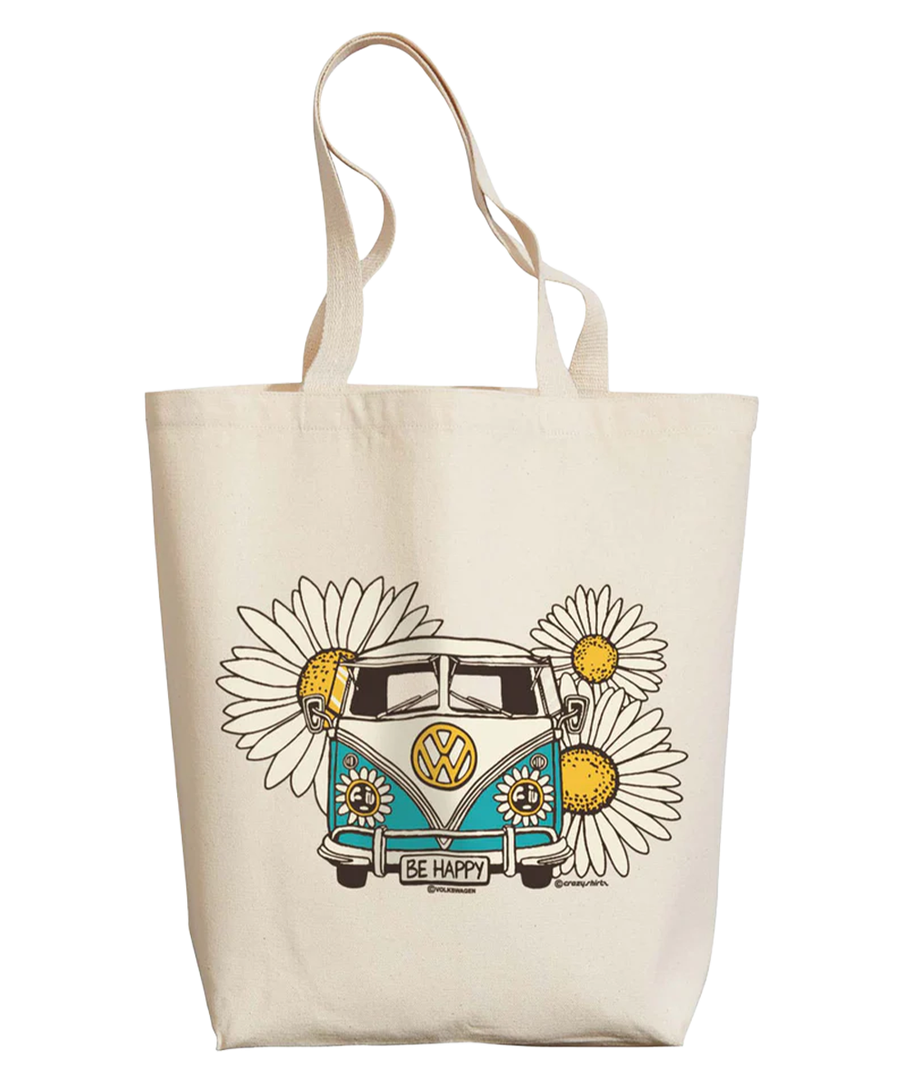 Beige tote bag with a blue Volkswagen van and daisy flower design with 'Be Happy' text, on a white background View 1