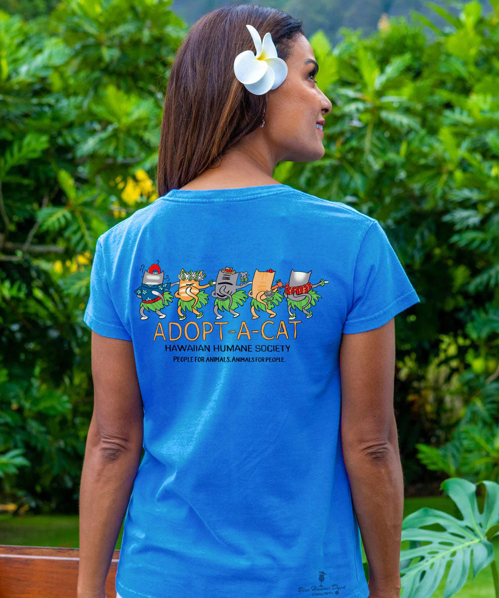 Woman wearing a blue t-shirt with 'Adopt a Cat' graphic in a garden setting View 3