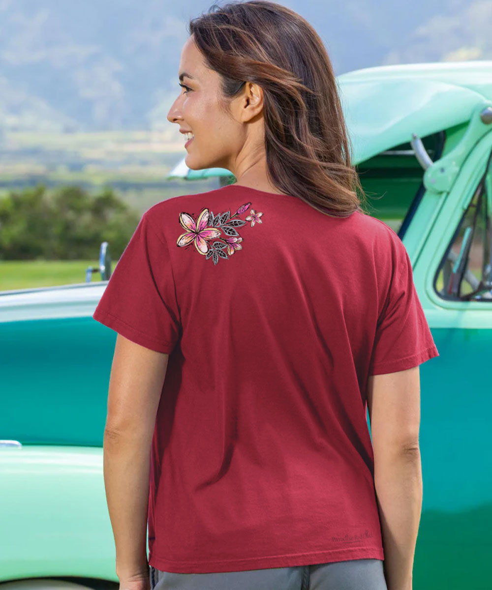 Woman wearing a maroon t-shirt with floral design outdoors View 3