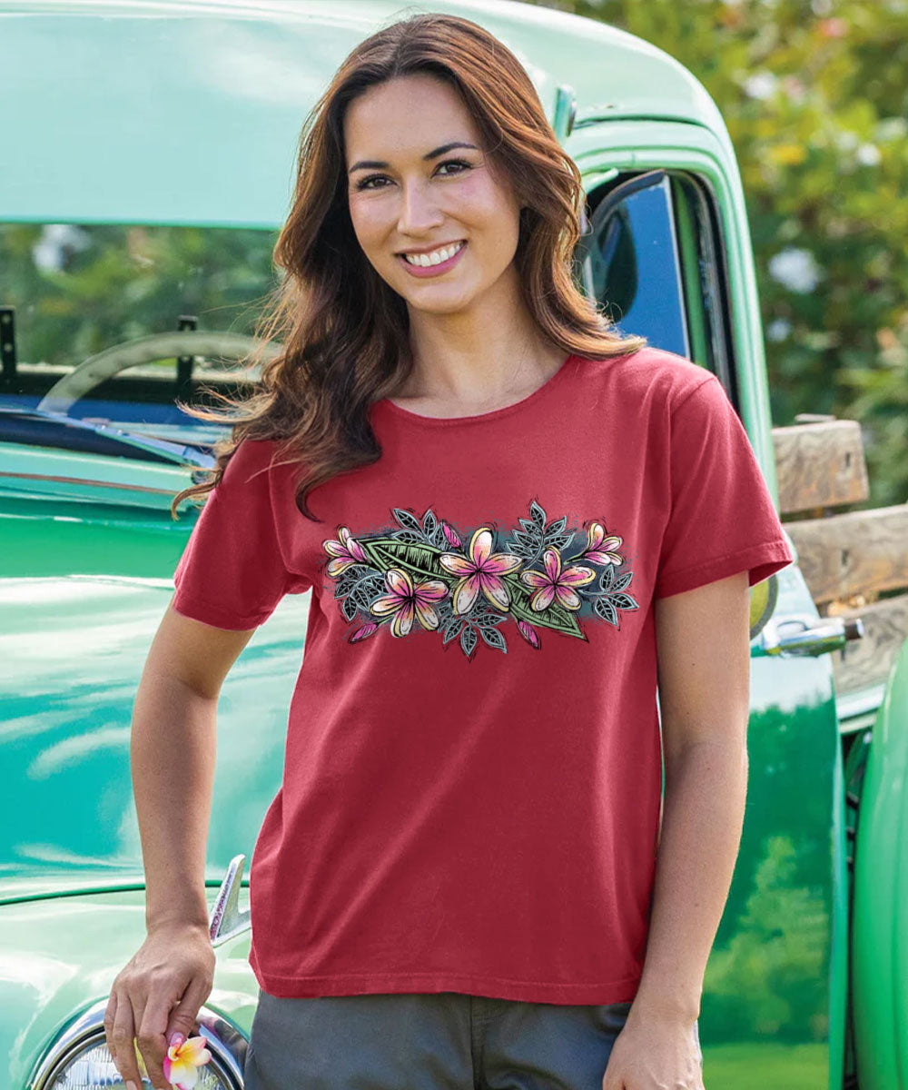 Woman wearing a maroon t-shirt with floral design outdoors View 2