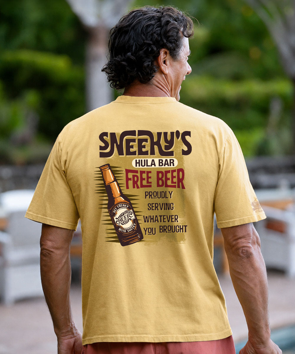 A man viewed from behind wearing a yellow graphic t-shirt with a design printed on the back, set against a blurred outdoor background. View 2