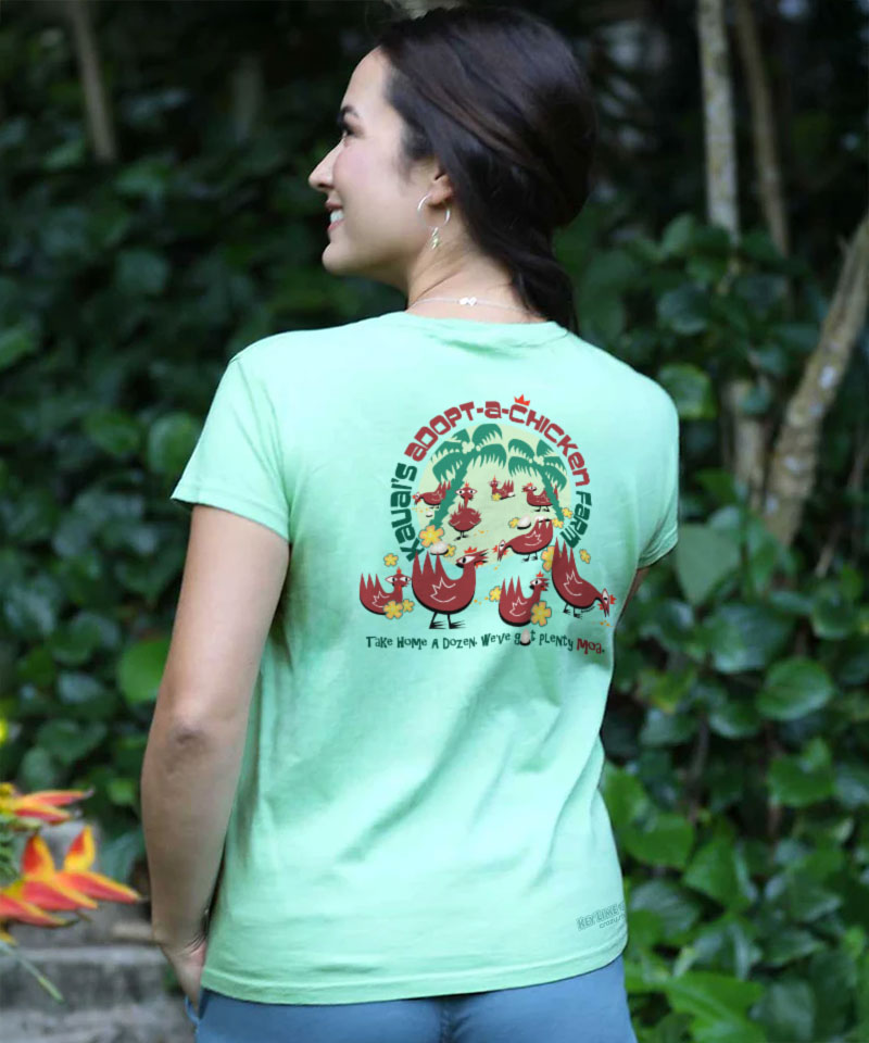 Person wearing a green t-shirt with a graphic design outdoors View 2