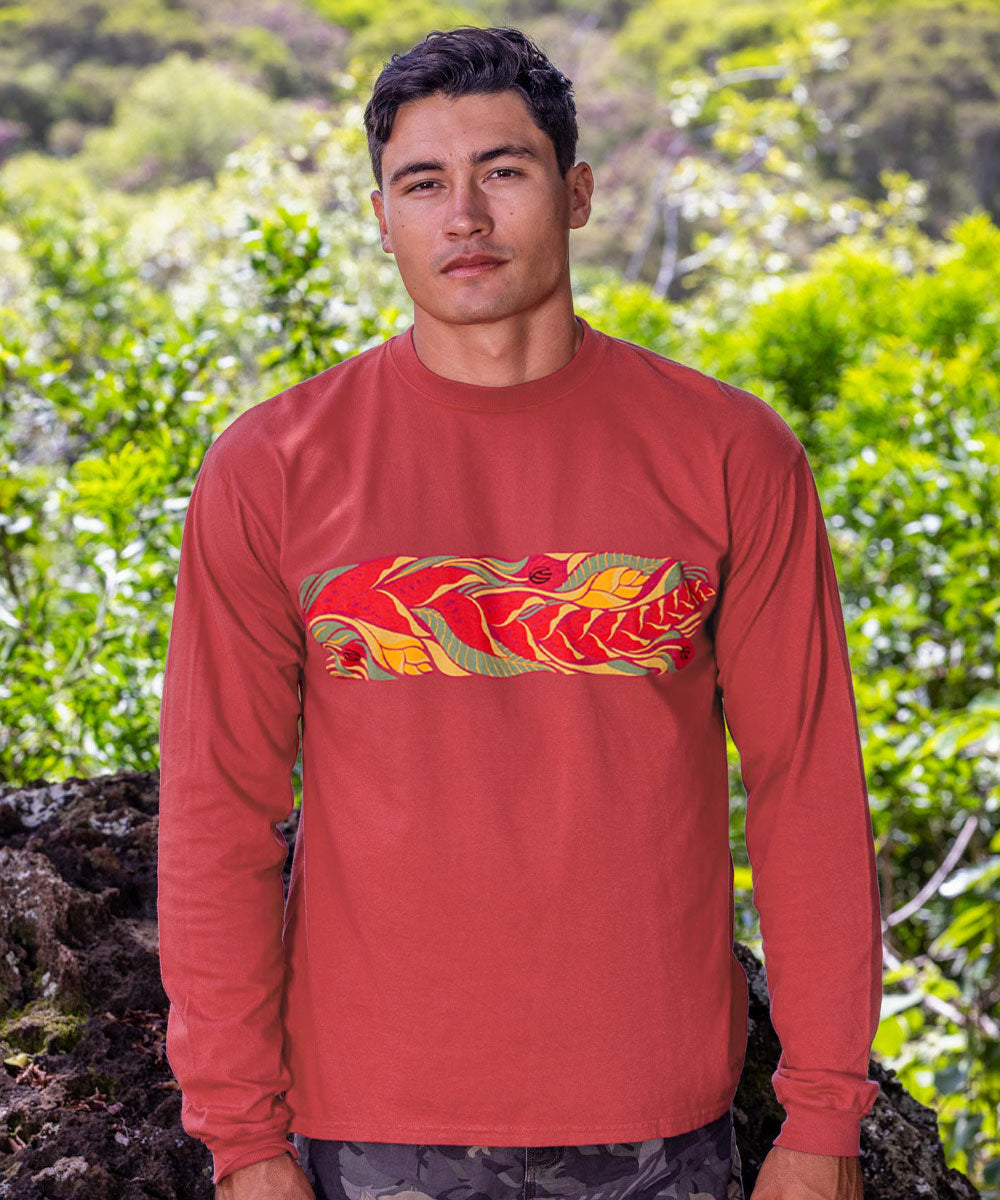 Man wearing a red long-sleeve shirt with a colorful graphic in a natural setting View 2