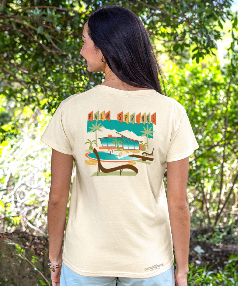 Person wearing a t-shirt with a graphic design in a natural setting View 2