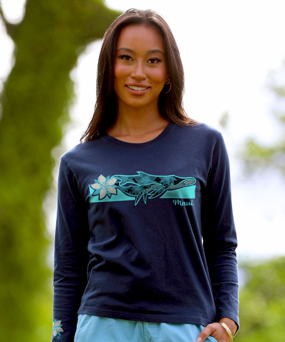 Woman wearing a navy long-sleeve shirt with a graphic design outdoors View 2