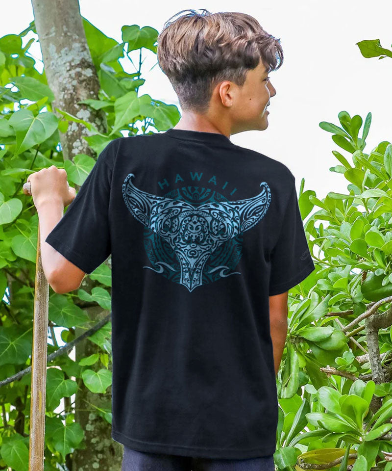 Person wearing a black t-shirt with a blue graphic design outdoors View 2
