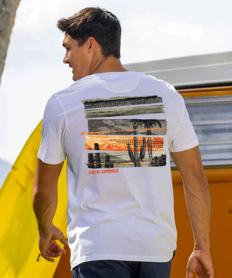 Man wearing a white t-shirt with a 'Palm Springs' design on the back, standing in front of a van View 2