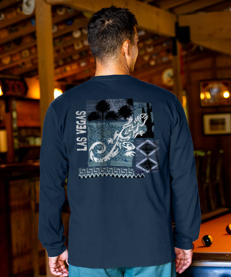 Person wearing a navy long-sleeve shirt with a graphic design on the back in a pool hall setting. View 2