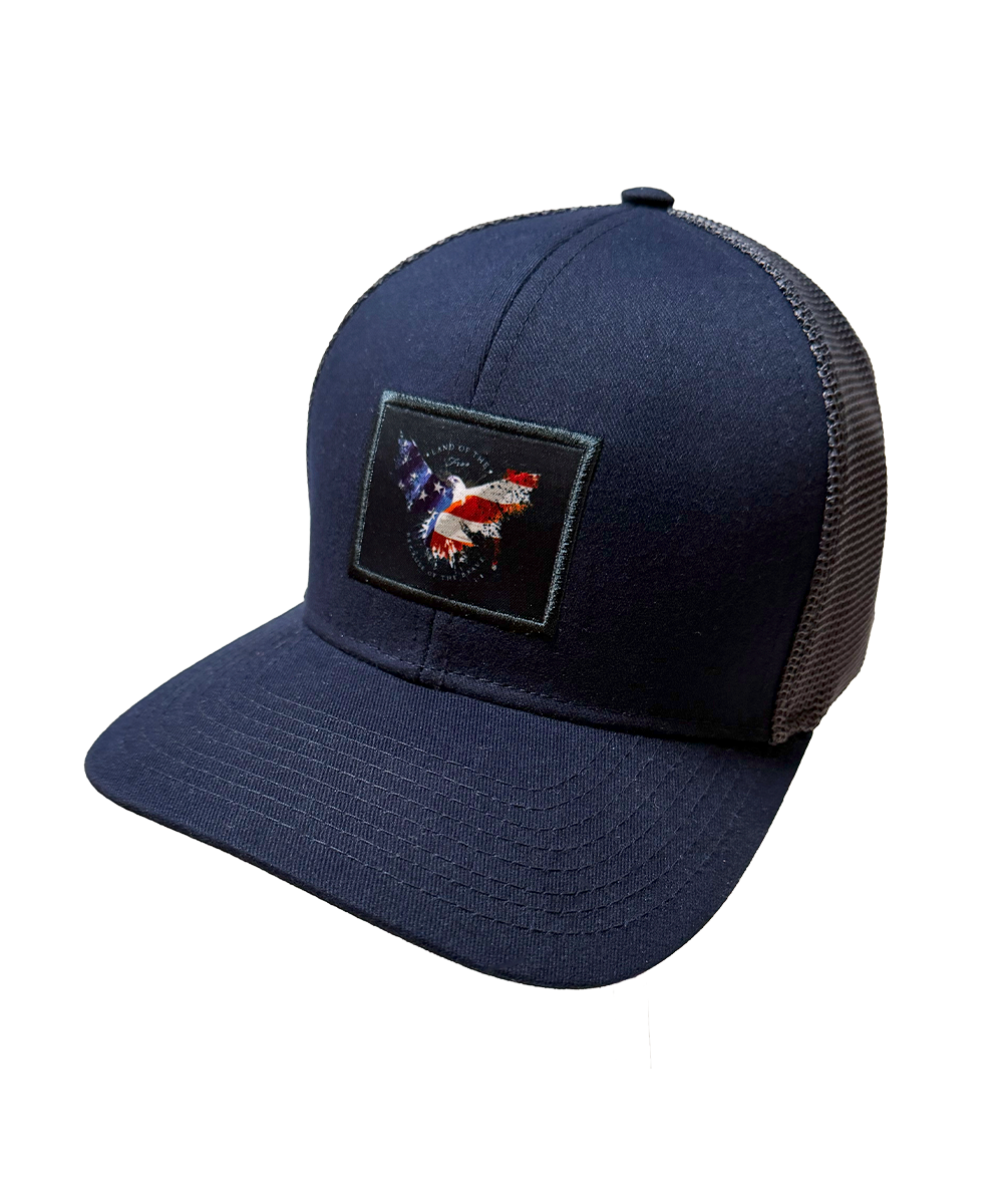 Navy blue trucker cap with a eagle patch on a white background View 1