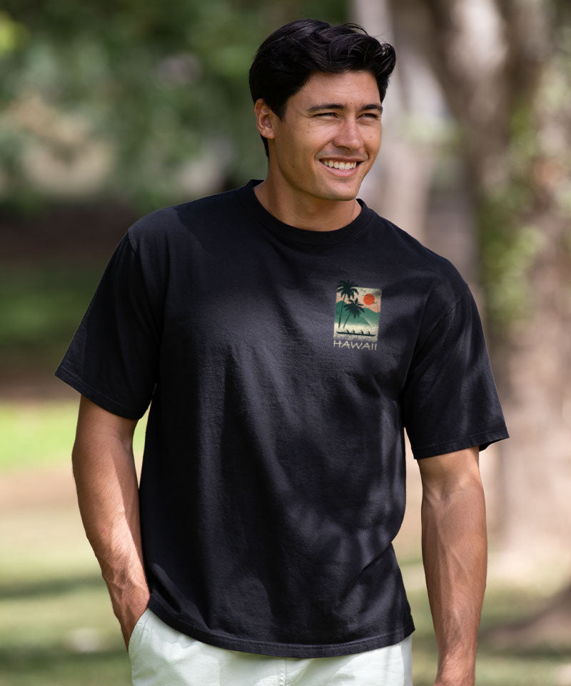 Man wearing a black t-shirt with a logo outdoors View 3