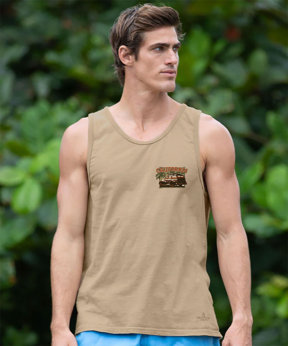 Man wearing a beige tank top with a logo against a green leafy background View 3