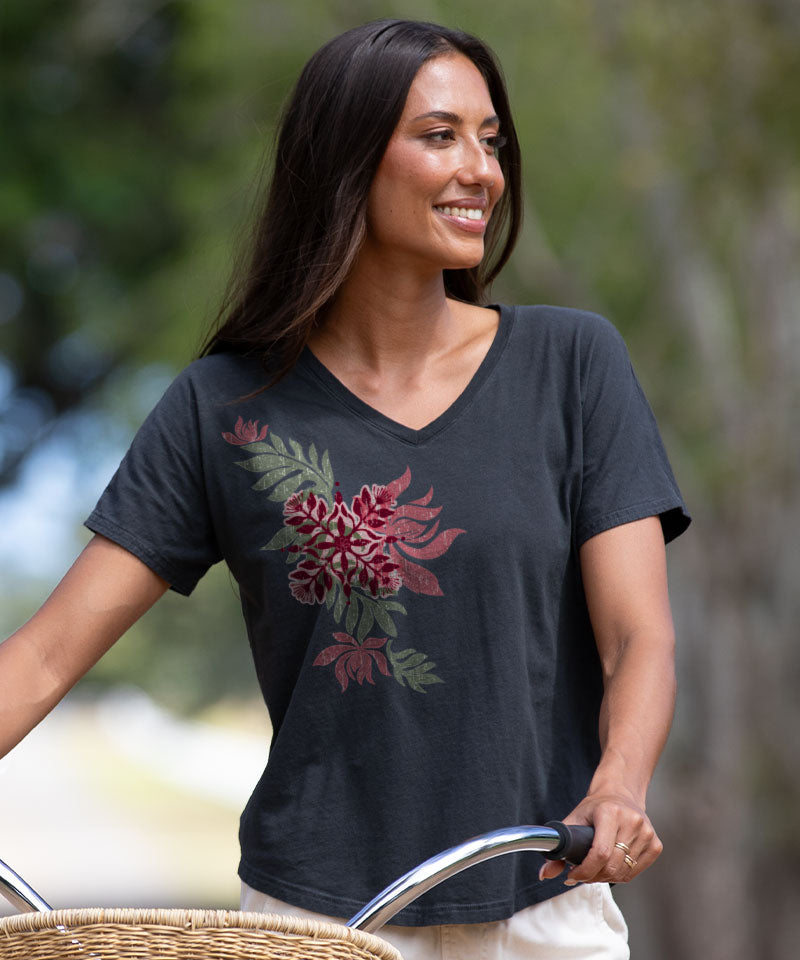 Woman wearing a black t-shirt with a floral design outdoors View 2