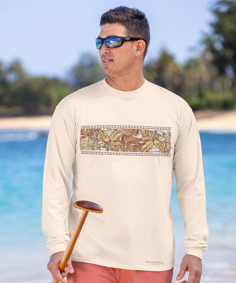 Man wearing a long-sleeve shirt with a graphic design on a beach View 2