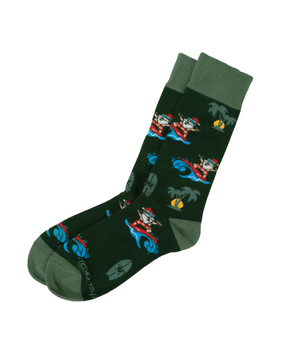 A pair of dark green crew socks with a repeating pattern of cartoon characters riding blue surfboards on tropical waves, with solid green toes, heels, and cuffs. View 1