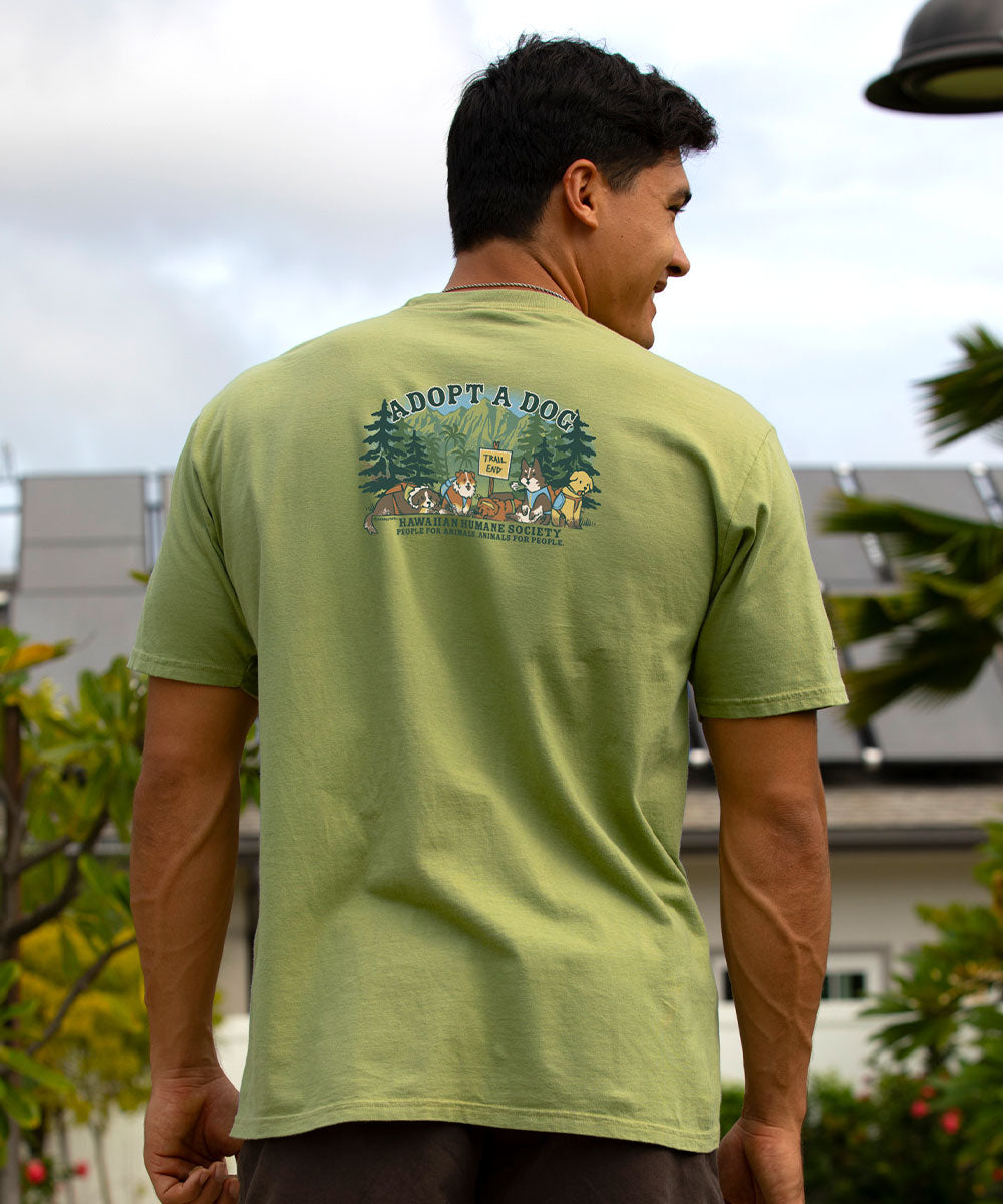 Person wearing a green t-shirt with 'Adopt a Dog' graphic on the back, standing outdoors. View 3