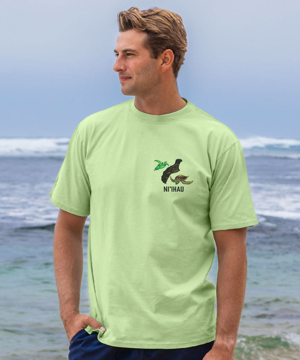Man wearing a light green t-shirt with a logo and text on a beach View 3