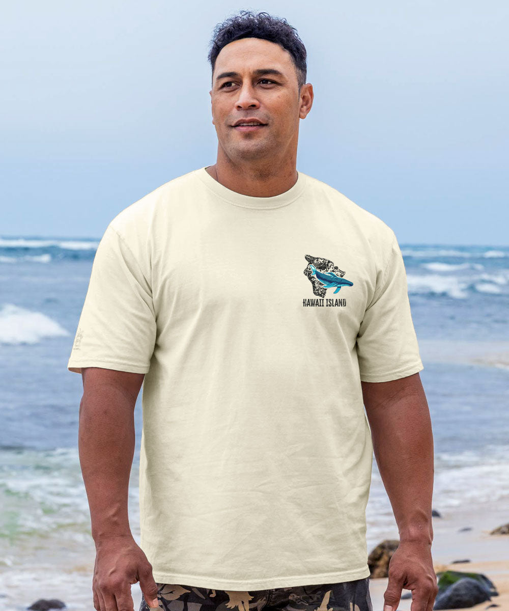 Man wearing a white t-shirt with a logo on a beach View 3