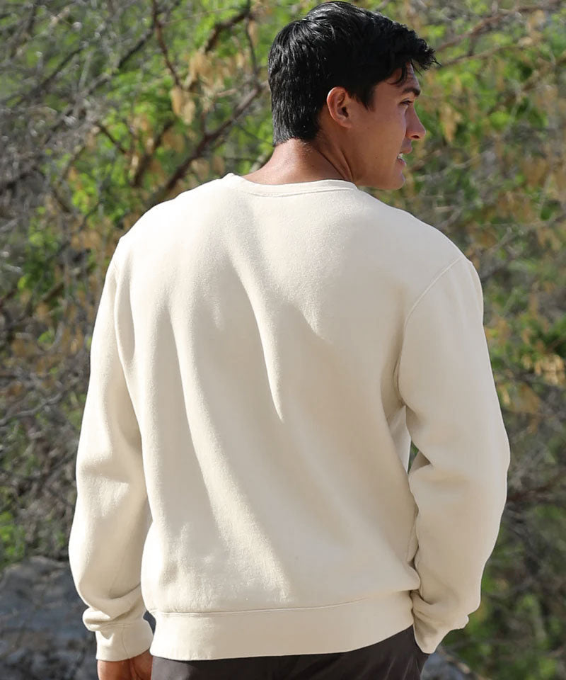 Person wearing a cream-colored sweatshirt with a natural background View 3