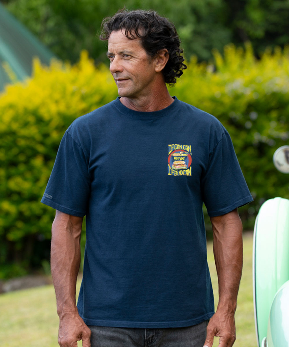 man wearing a navy t-shirt with a design of a spam can with yellow text "If Can Can, If No Can, No Can" against a white background. View 3