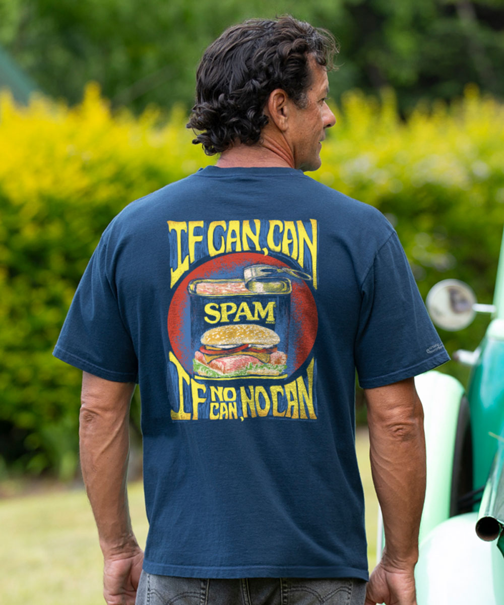man wearing a navy t-shirt with a design of a spam can with yellow text "If Can Can, If No Can, No Can" against a white background. View 2