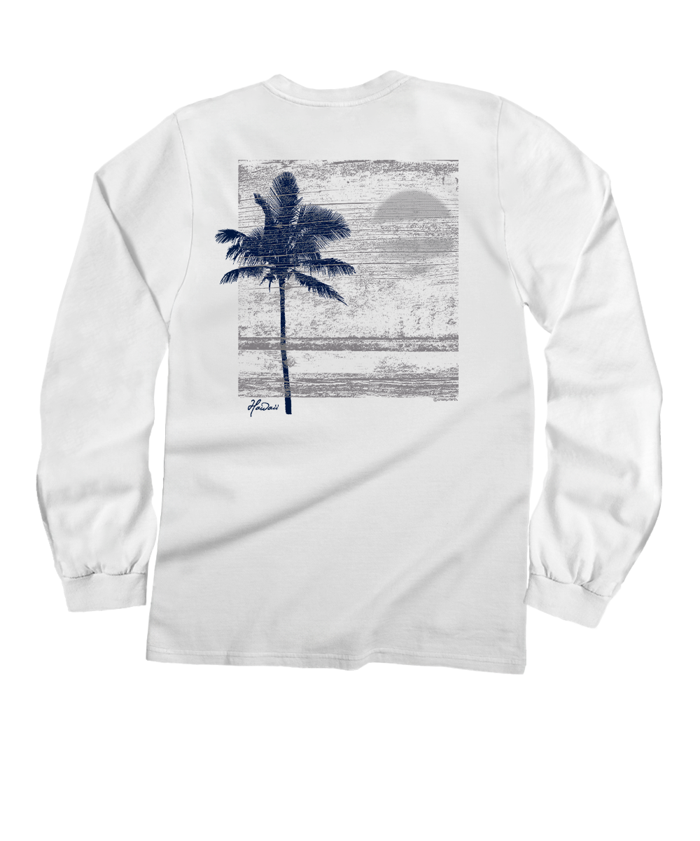 A white long-sleeve t-shirt shown from the back, featuring a large rectangular graphic print of a dark blue palm tree silhouette against a textured gray and blue sunset beach scene. View 1