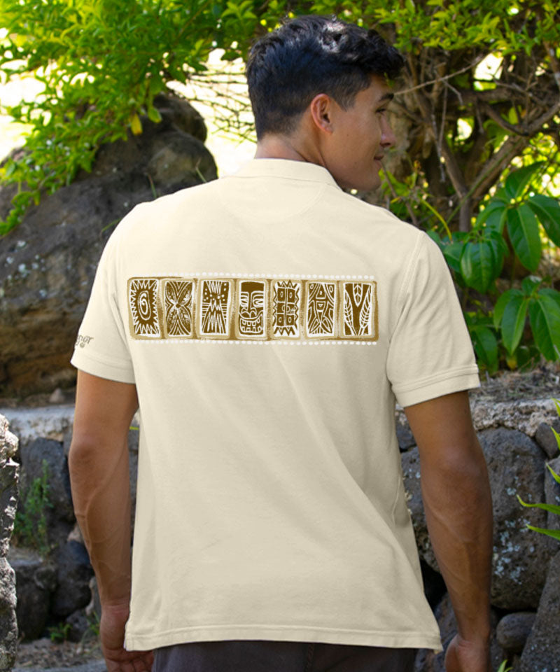 Man wearing a white polo shirt with a decorative pattern, standing outdoors with greenery in the background. View 3